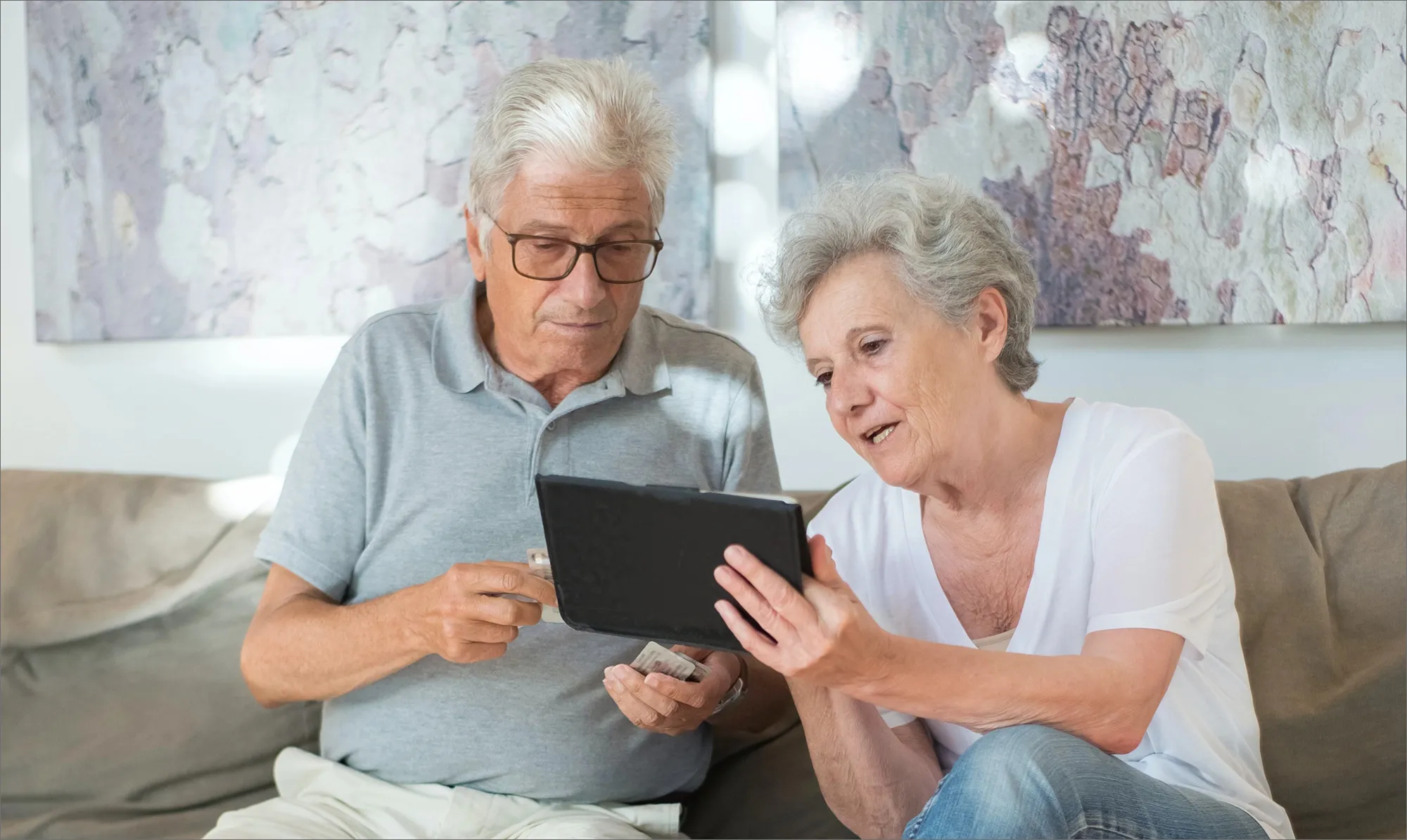An older person using the Bleta tablet
